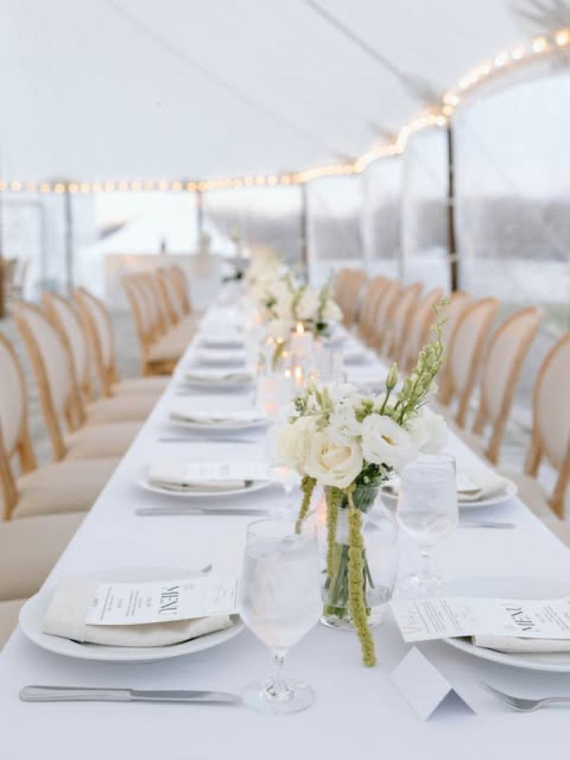 Instagram: a long reception table set under the sailcloth tent