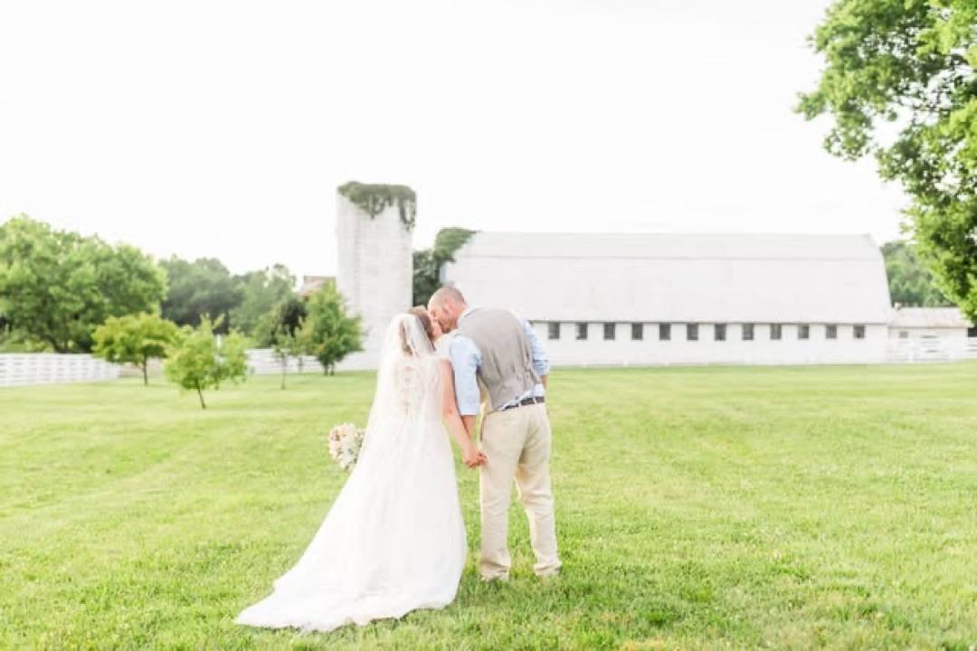 Instagram: a couple by the white barn and silo