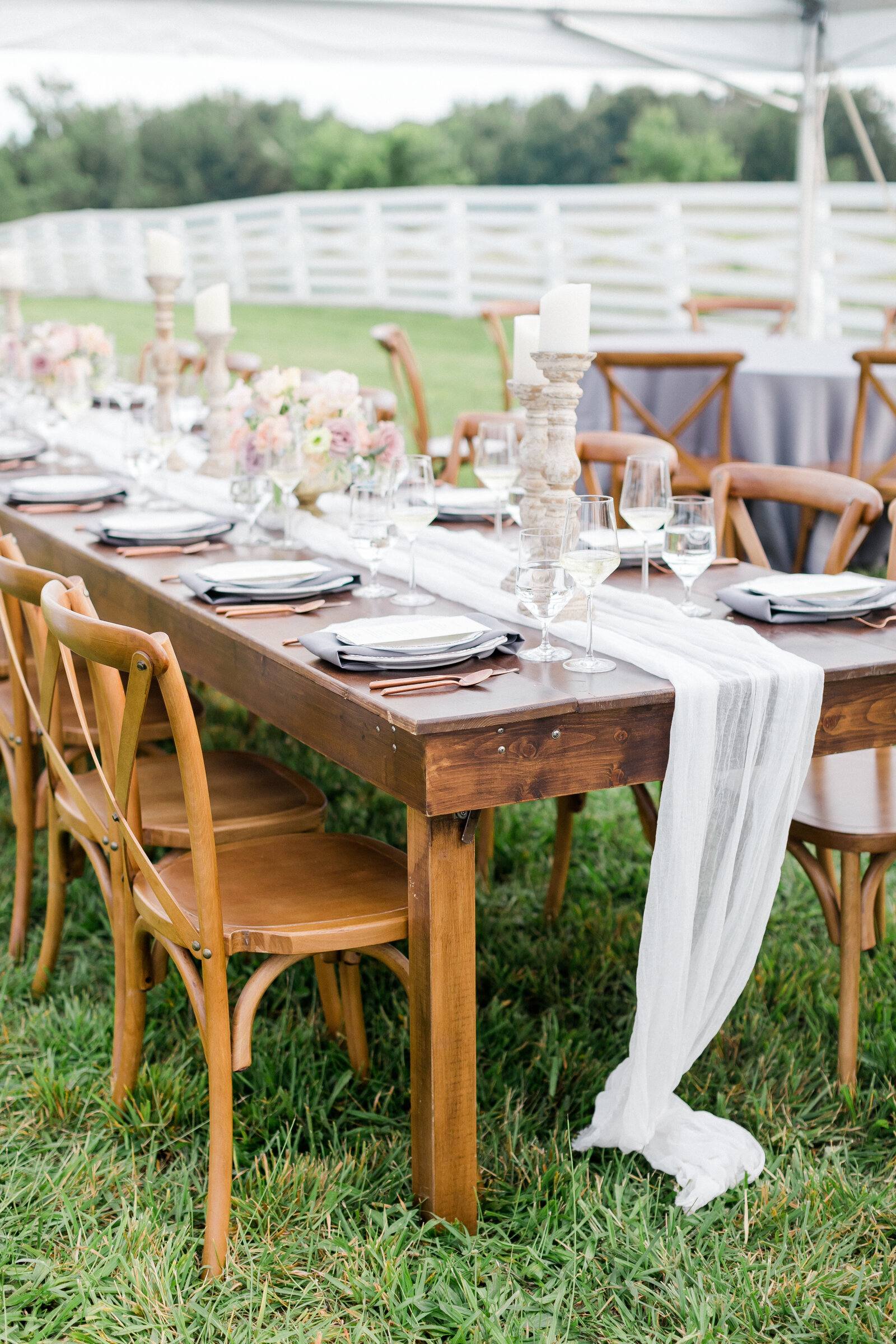 A long wooden table set for dinner