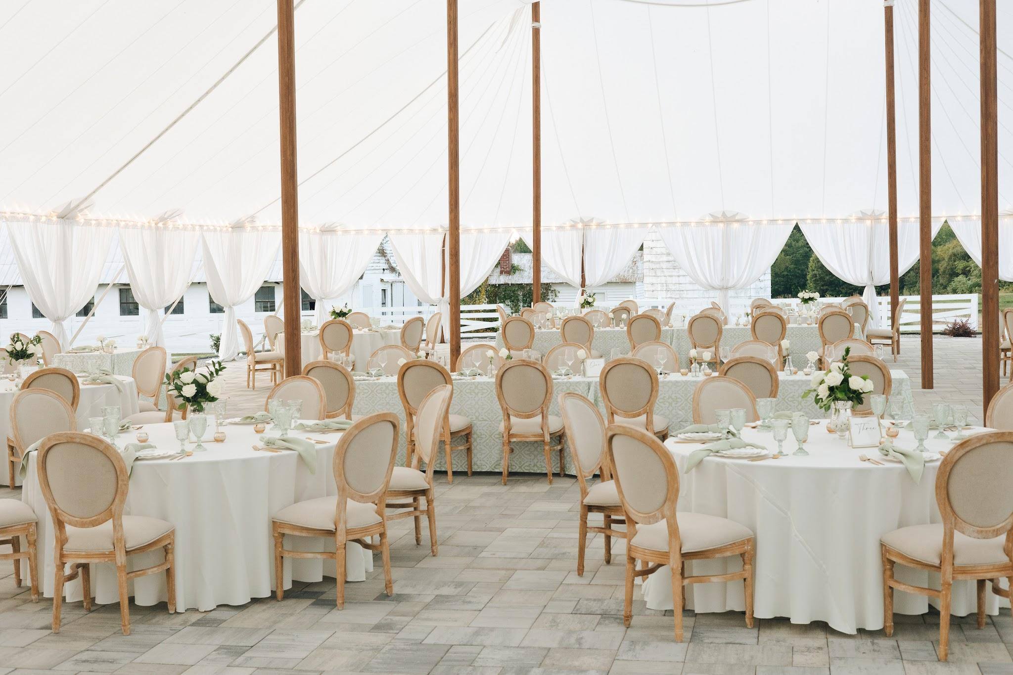 Tables set under the sailcloth tent