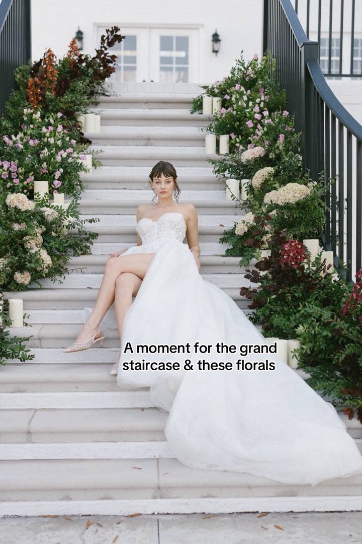 TikTok: a bride on the grand staircase framed by florals
